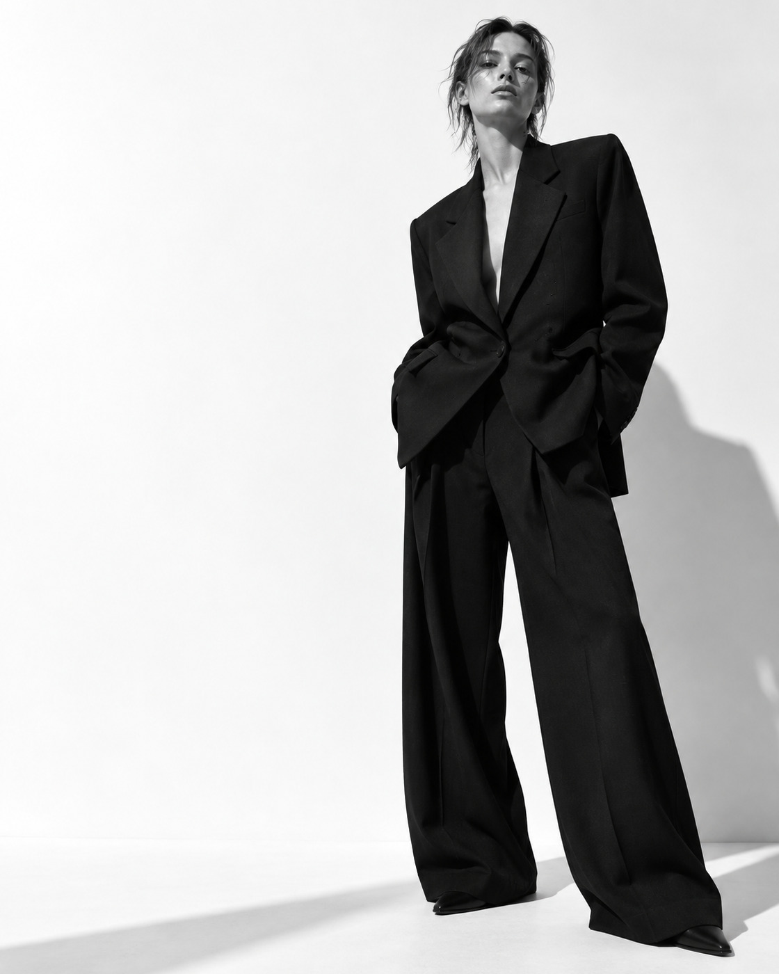 Model in oversized black tailoring